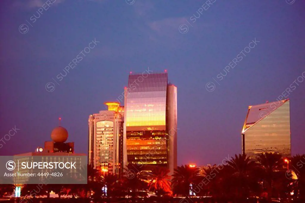 Illuminated high rise buildings in the evening, Deira, Dubai, UAE, United Arab Emirates, Middle East, Asia