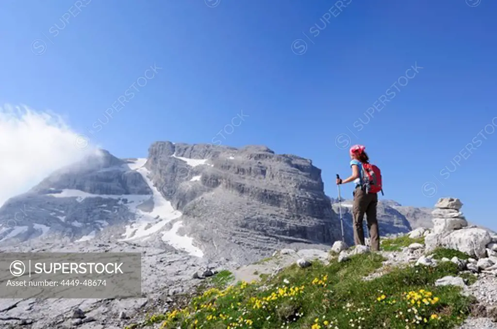 Woman ascending to Cima Groste, Brenta group, Trentino-Alto Adige/Suedtirol, Italy