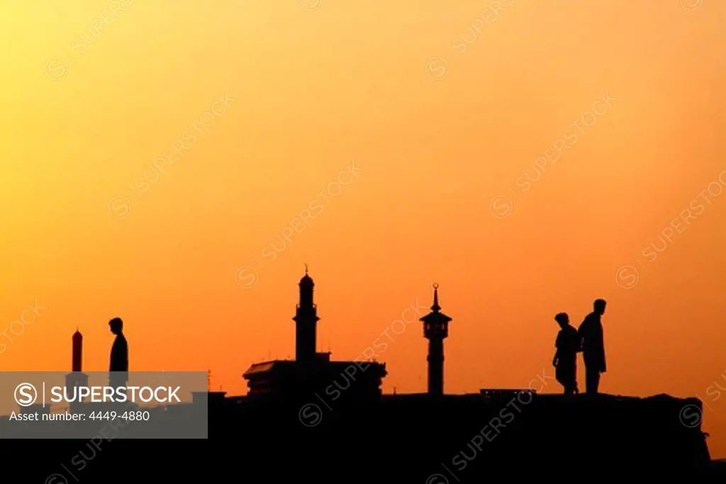 Silhouettes of people and minarets in the afterglow, Dubai Creek, Dubai, UAE, United Arab Emirates, Middle East, Asia