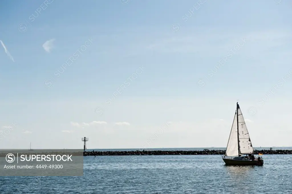 Sailing boat leaving the harbour, Island of Ruegen, Mecklenburg-Vorpommern, Germany