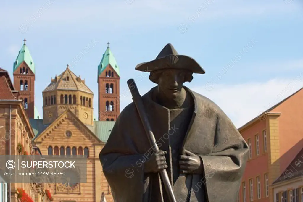 Sculpture of a pilgrim in Maximilianstrasse and Speyer cathedral, Rhineland-Palatinate, Germany, Europe