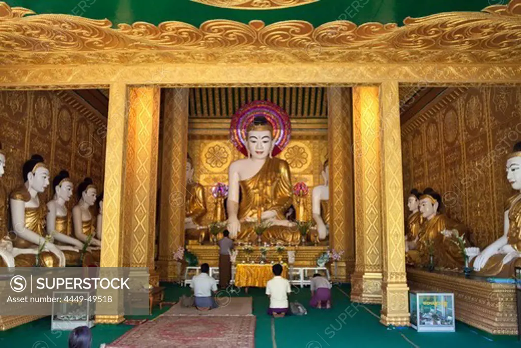 People and buddhistic statues at Aung Theikdi Pagoda in Mawlamyaing, Mon State, Myanmar, Birma, Asia