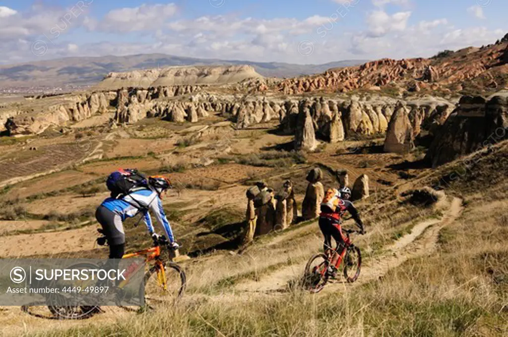 Mountain bikers near Cavusim, Goereme valley, Goereme, Cappadocia, Turkey