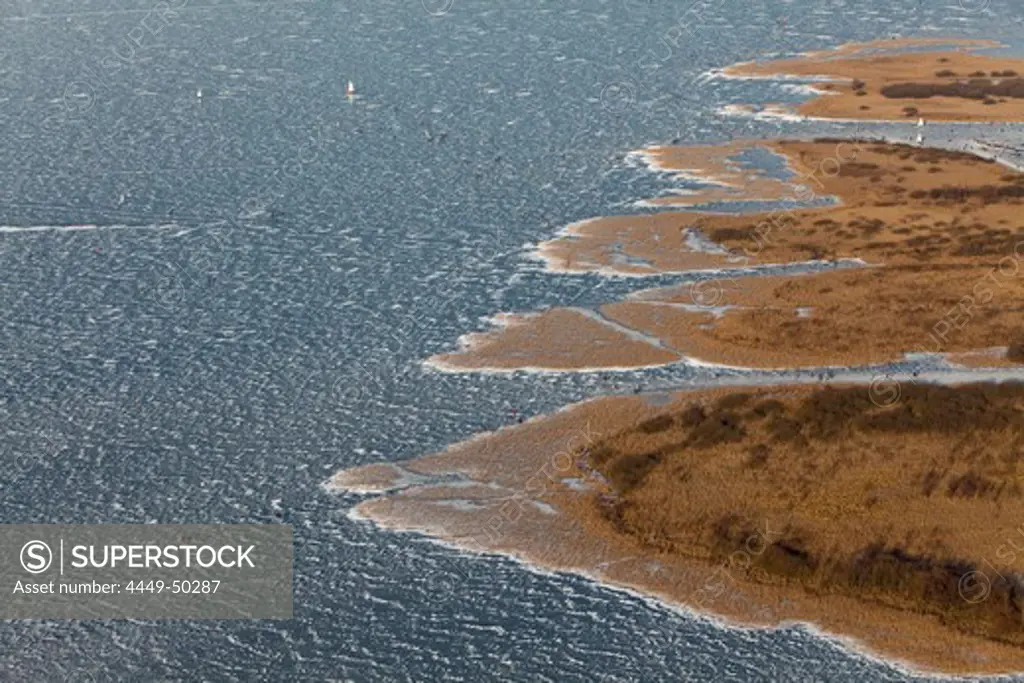Aerial of Lake Steinhude, frozen water surface in winter, reeds, Hannover region, Lower Saxony, Germany