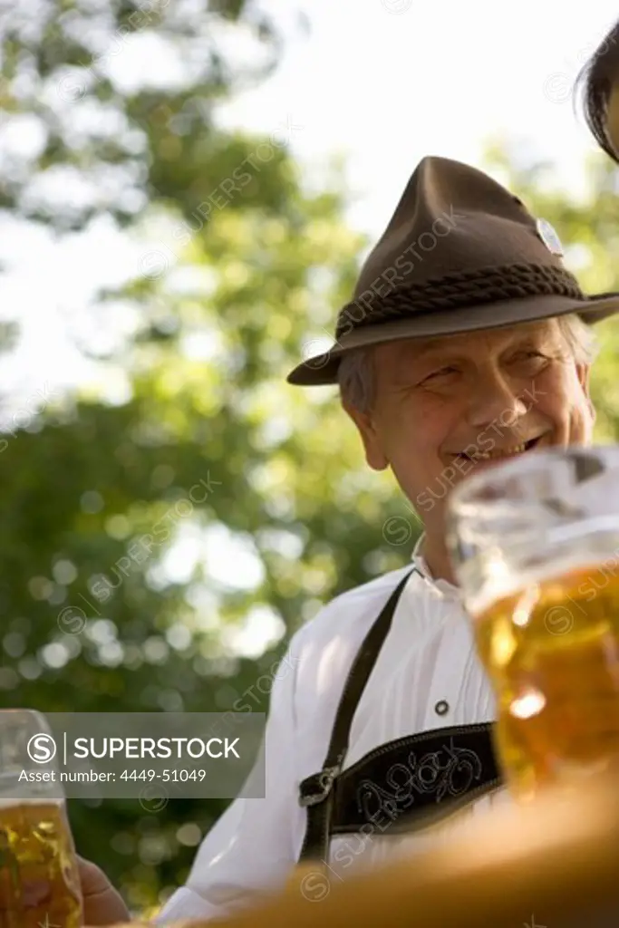 Senior man in beergarden near Lake Starnberg, Bavaria, Germany