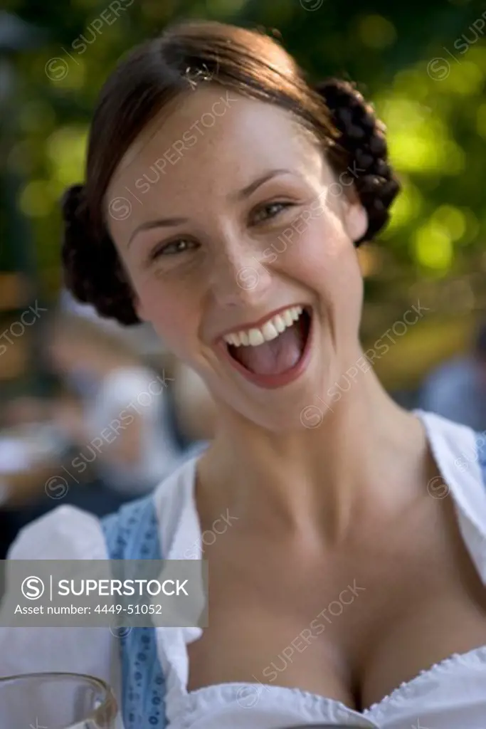 Waitress in beergarden near Starnberger See, Bavaria, Germany