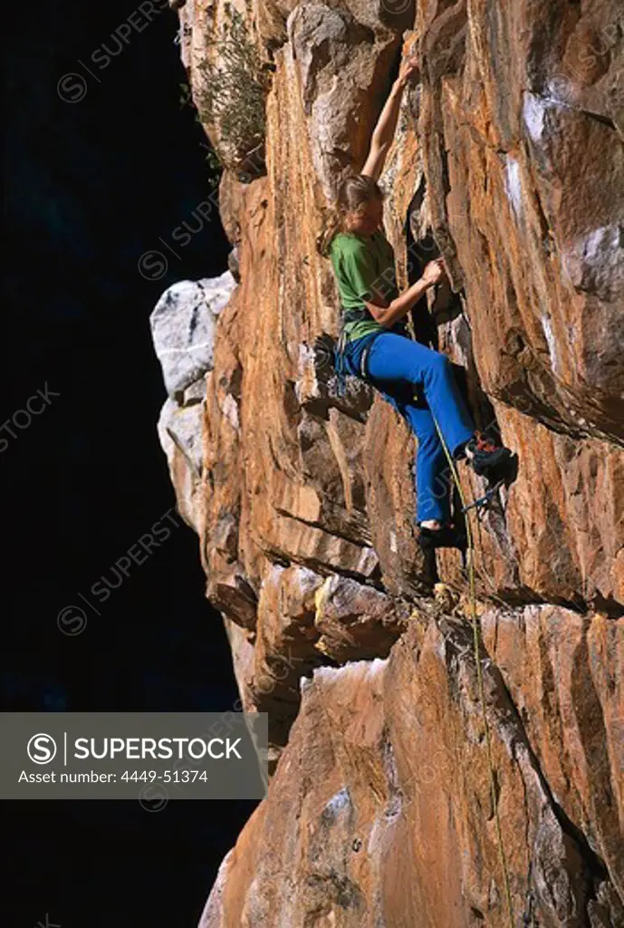 Woman rock climbing, Montagu, South Africa
