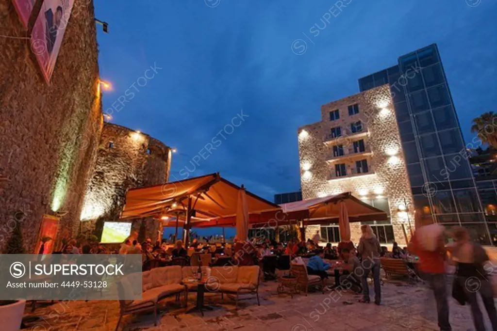 Restaurants at the city wall in the evening, Budva, Montenegro, Europe