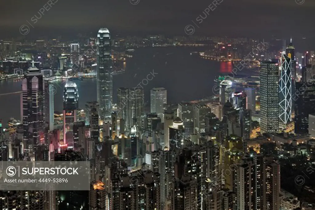 View of Hong Kong from Victoria Peak over Victoria Harbour and the illuminated skyscrapers at night, Hong Kong, China
