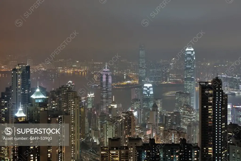 View of Hong Kong from Victoria Peak towards Victoria Harbour and Kowloon and the illuminated skyscrapers at night, Hong Kong, China
