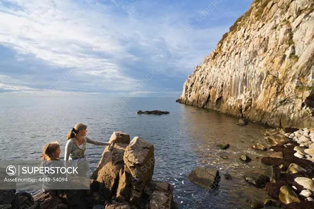 Woman and girl at the cliffs of Jons Kapel, Bornholm, Denmark, Europe