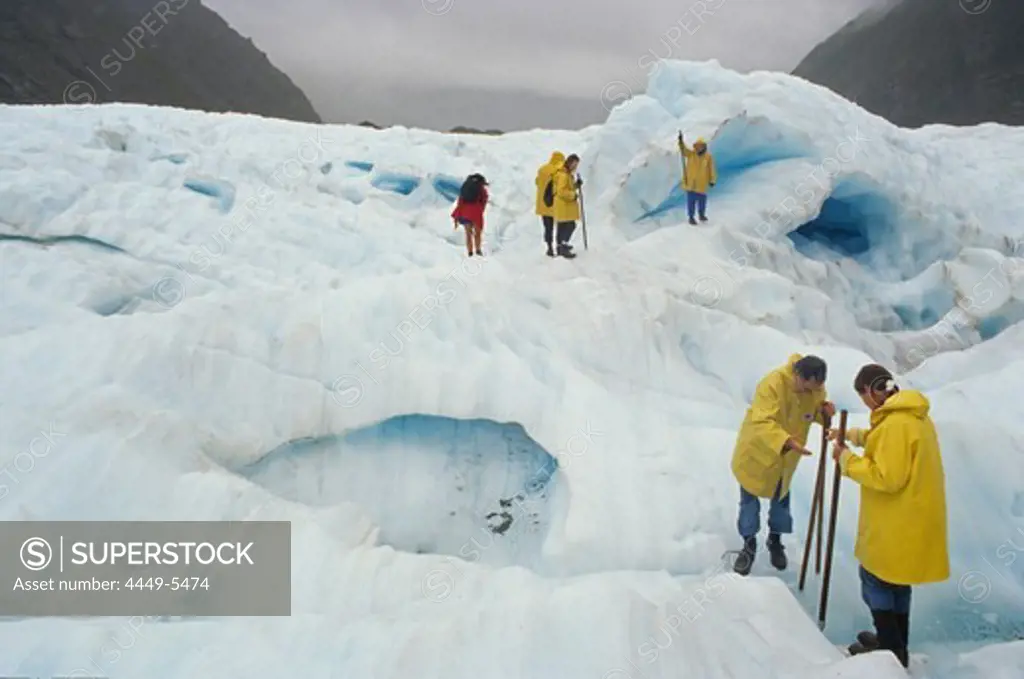 Tourists on Fox Glacier, Westland National Park, South Alps, South Island, New Zealand, Oceania