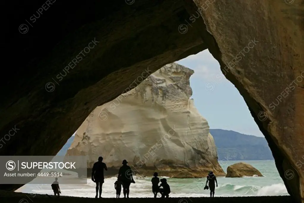 People on the beach in Cathedral Cave at Coromandel Peninsula, North Island, New Zealand, Oceania