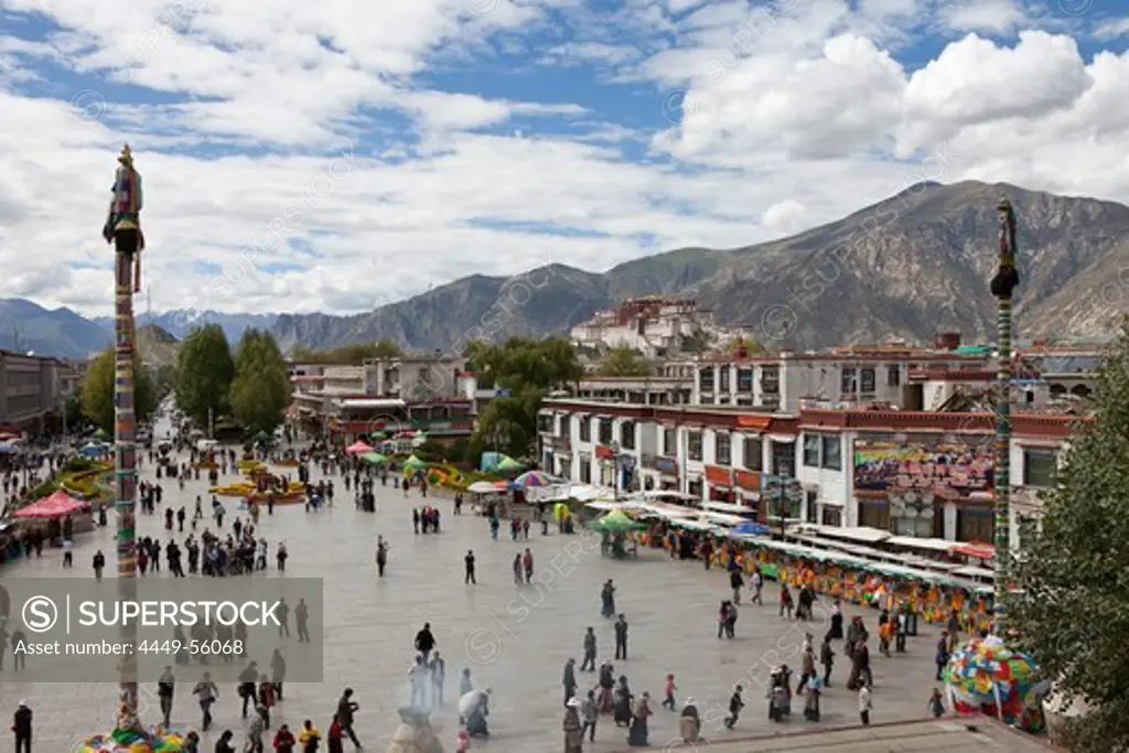 Barkhor Square with pilgrims in the old part of Lhasa with Potal, Tibet Autonomous Region, People's Republic of China