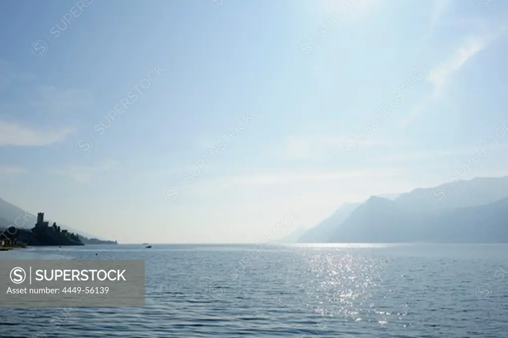 Lake Garda with castel of Malcesine and mountains of Lake Garda in the background, Malcesine, Lake Garda, Veneto, Italy, Europe