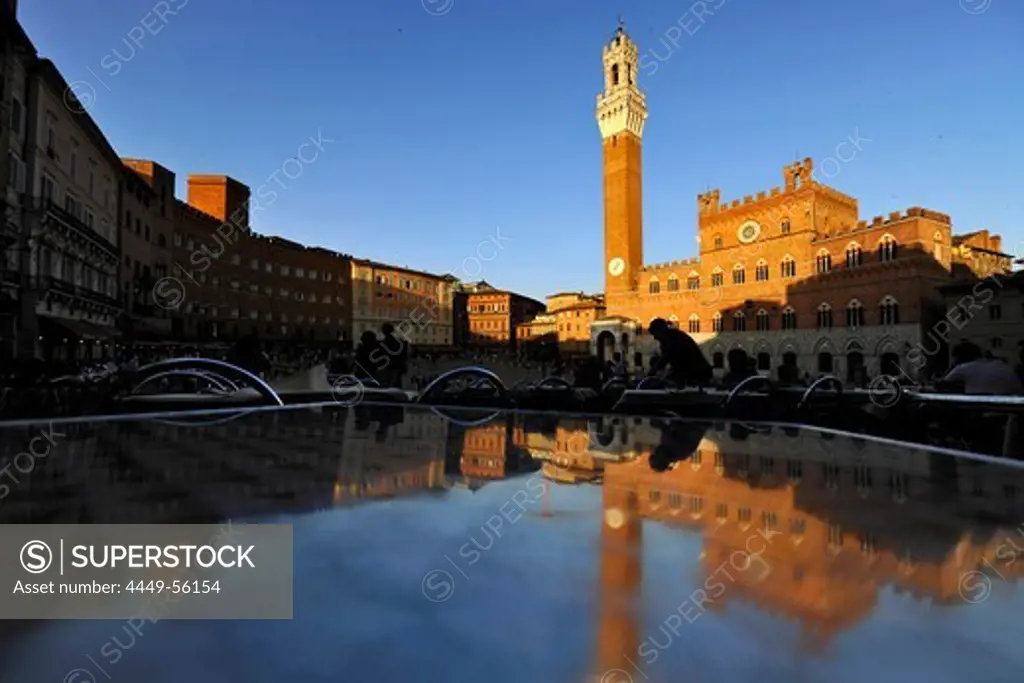 View of Palazzo Pubblico and fountain on square Piazza del Campo, Siena, Tuscany, Italy, Europe