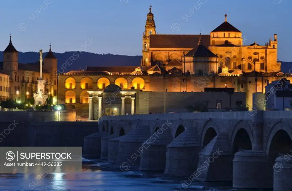 Illuminated cathedral La Mezquita, roman bridge and the river Guadalquivir in the evening, Cordoba, Andalusia, Spain, Europe