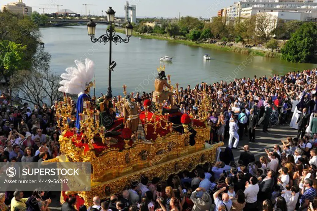 Crowd and brotherhood La Estrella during procession on Palm Sunday, Semana Santa, Triana, Sevilla, Andalusia, Spain, Europe