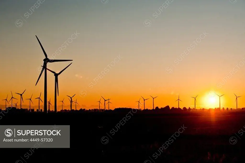 Wind wheels at a wind farm at sunset, Schleswig Holstein, Germany, Europe