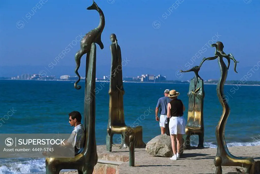 Sculptures and people on the waterfront in the sunlight, Malecon, Puerto Vallarta, Jalisco, Mexico, America