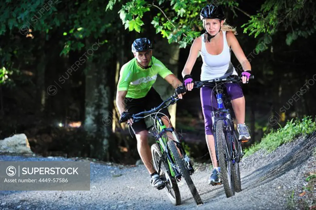 Two mountain bikers in a bike park, Hochries, Samerberg, Upper Bavaria, Germany