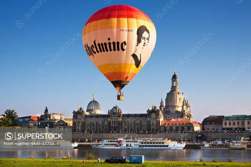 Balloons rising from the Elbe riverbank, Bruehlsche Terrasse and Frauenkirche in the background, Dresden, Saxonia, Germany, Europe