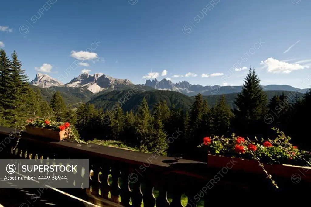 View from a balcony onto mountains in the sunlight, Dolomites, Alto Adige, South Tyrol, Italy, Europe