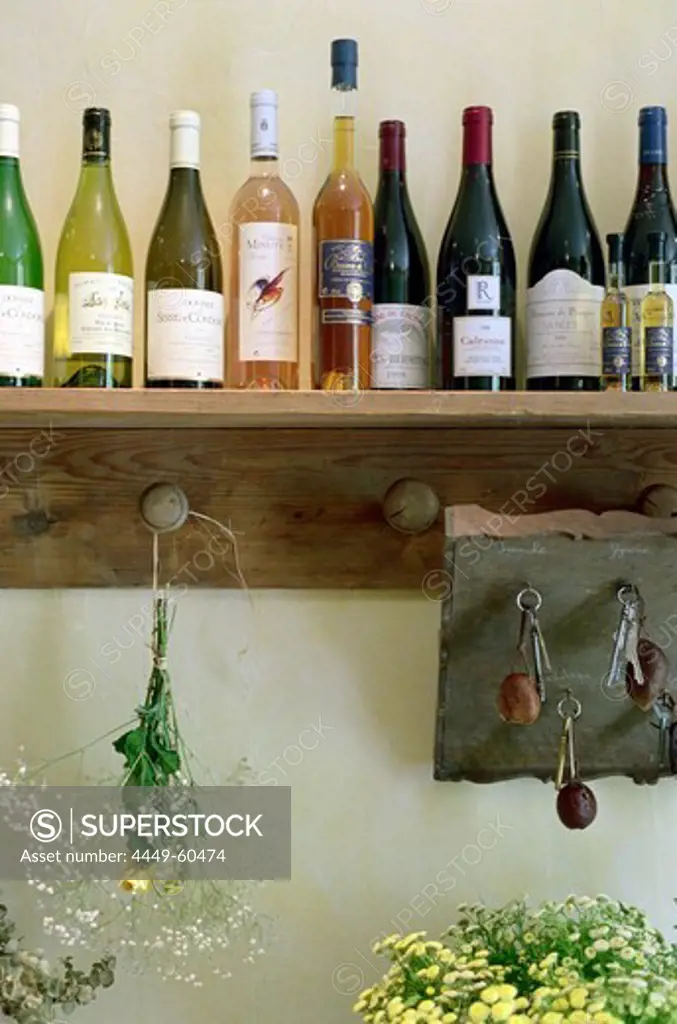 Wine bottles on a shelf at a hotel, Drome, France, Europe