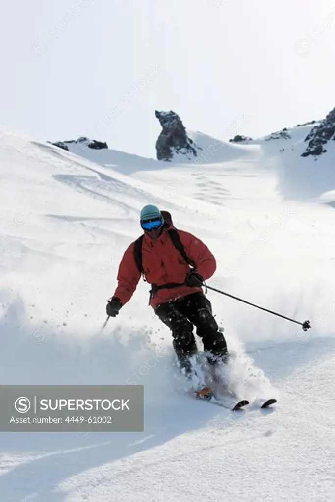 Heliskiing at Kamchatka, Sibiria, Russia, a man skis the powder