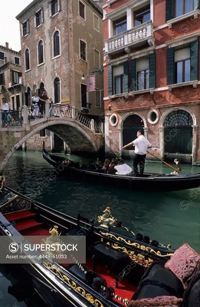 Canal with bridge and boats (gondolas), Venice, Venezia, Italy