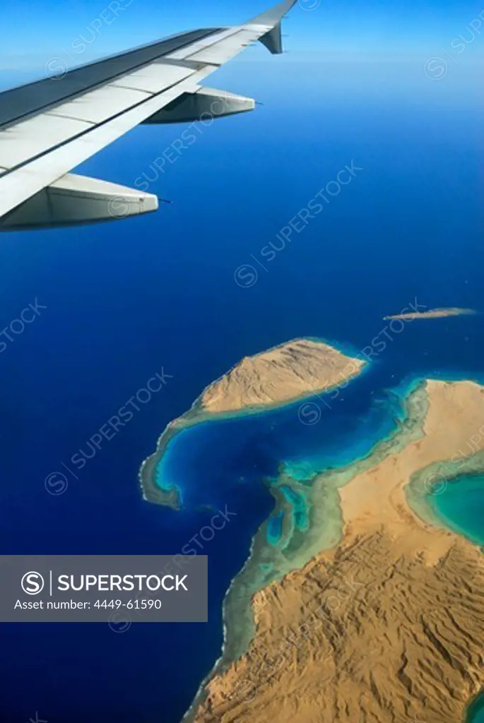 Aircraft wing above Red Sea, shore with reef, Hurghada, Egypt, Africa