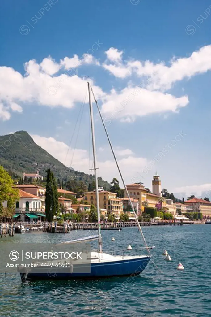 Boat at the jetty, Gardone, Lake Garda, Lombardy, Italy