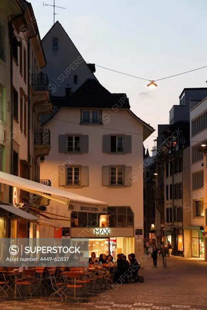 People sitting in a cafe in the evening light, Barfuesserplatz, Gerbergasse, Basel, Switzerland