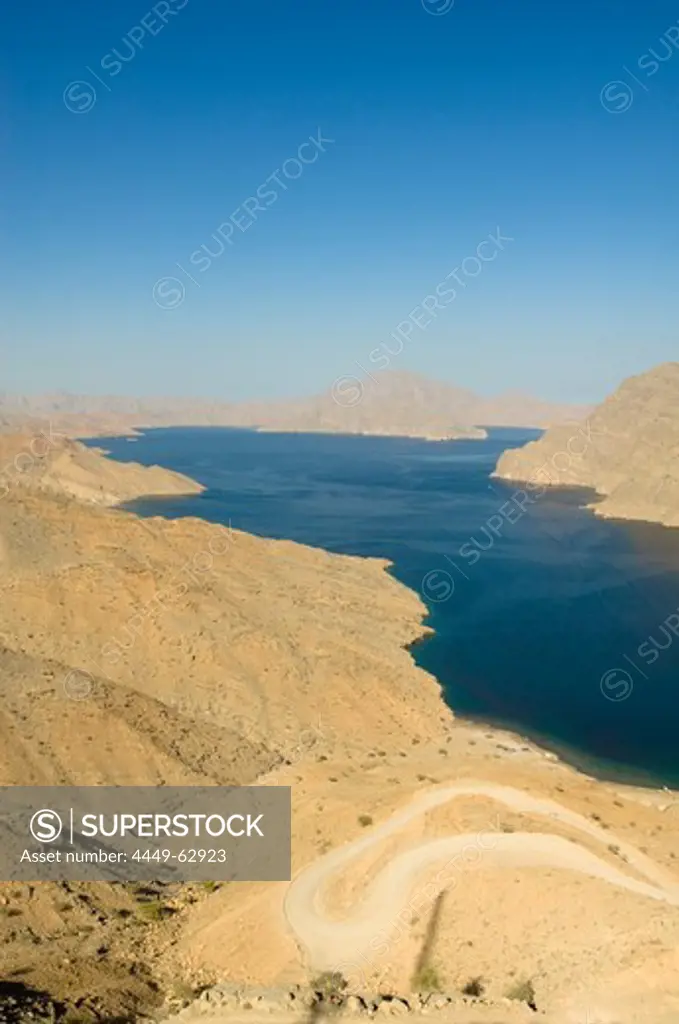Fjord in the Haijar Mountains with mountain road, Kashab, Khasab, Musandam, Oman