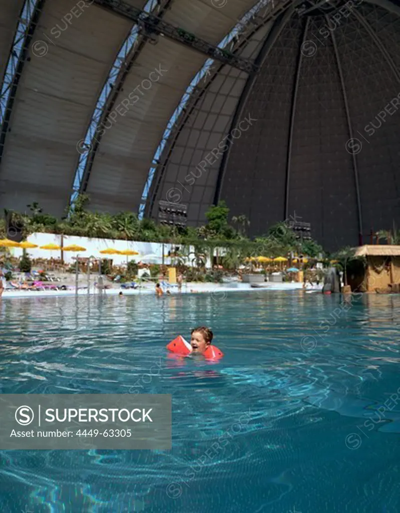 Girl swimming in pool, Tropical Island Resort, artficial beach world, in ex- Cargolifter hall (largest unsupported hall in the world: 360 x 210 x 107 m), in Krausnick, Lower Spreewald, Brandenburg, Germany