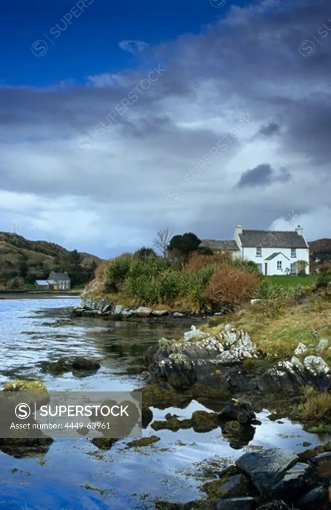 Cottage at Coulagh Bay under clouded sky, County Kerry, Ireland, Europe