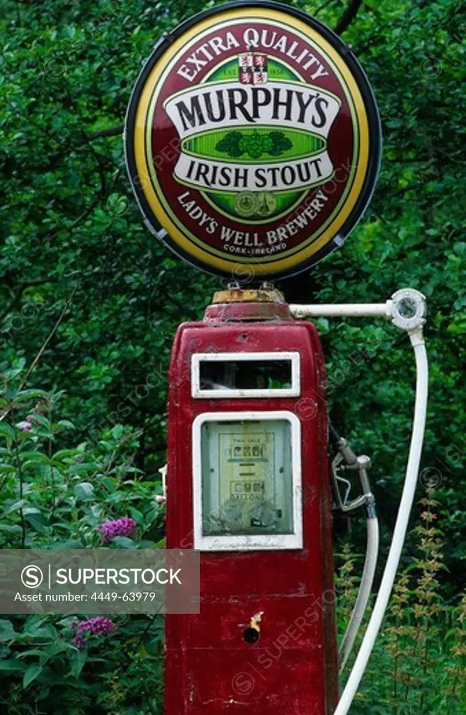 Old gas station, petrol station with Murphys beer sign on top near a pub in Lauragh on the Ring of Beara, County Kerry, Ireland, Europe