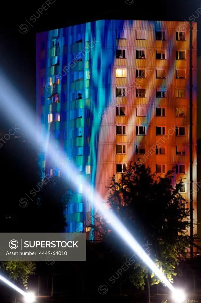 Beam of light and high rise building at night, Linz, Upper Austria, Austria .