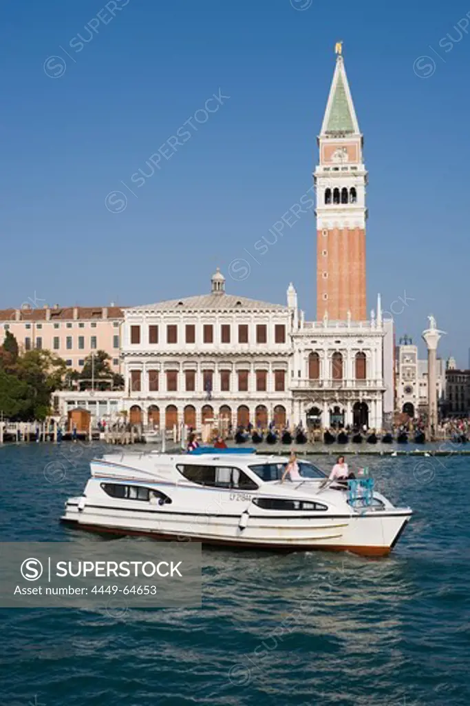 Le Boat Magnifique houseboat cruising past the Campanile Tower and Basilica San Marco, Venice, Veneto, Italy