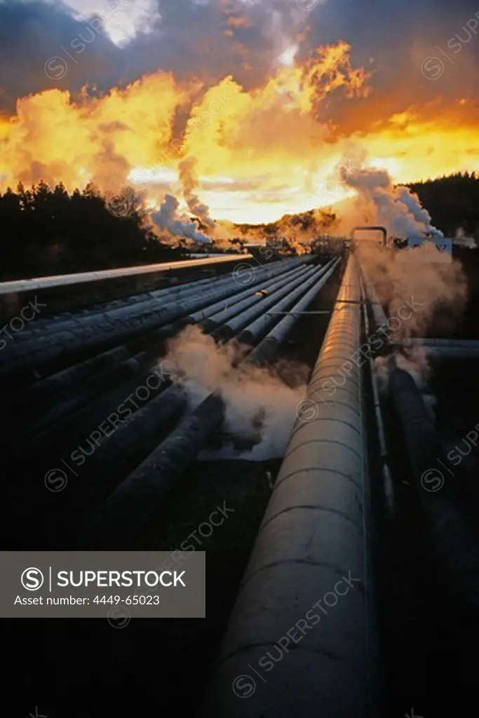 Wairakei Geothermal Power Station, Pipelines and steam at sunset, near Taupo, North Island, New Zealand