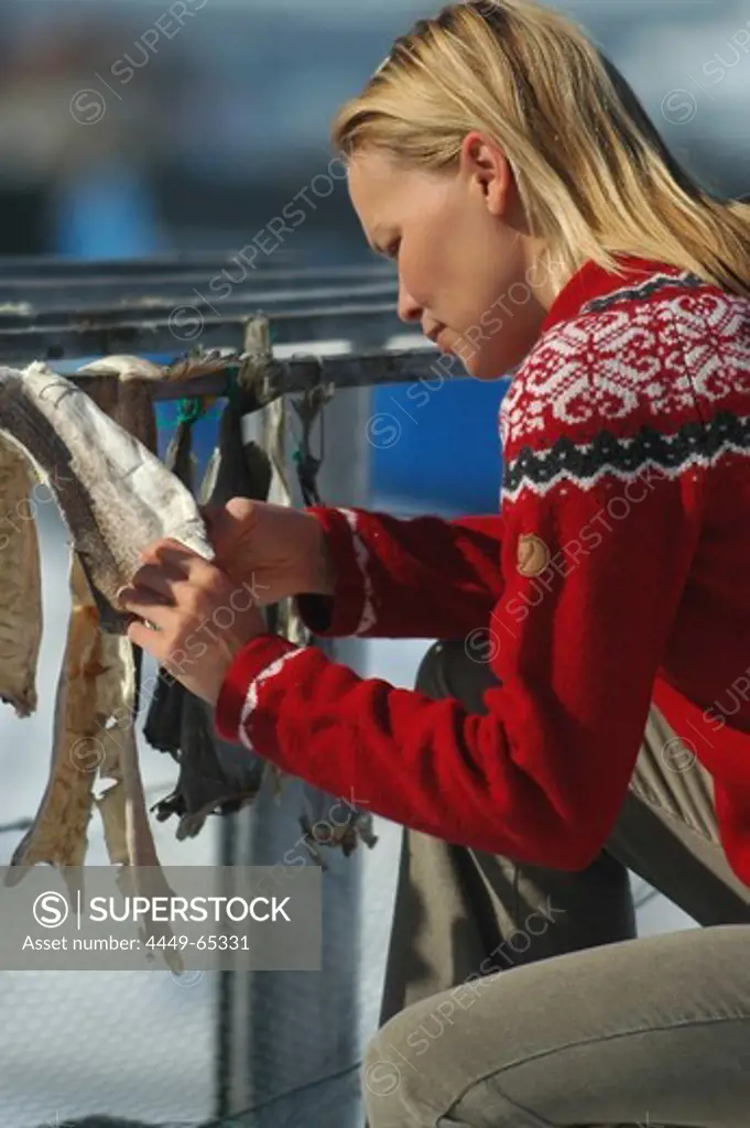Woman with dried fish, Ilulissat, Greenland