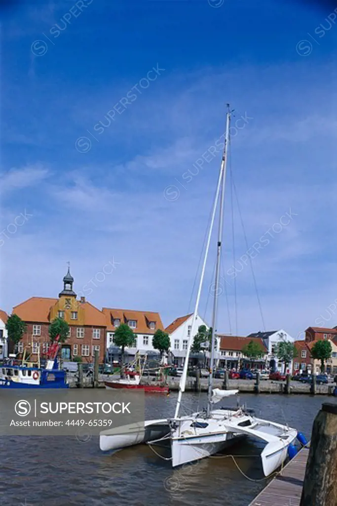 Houses and harbour under clouded sky, Toenning, Eiderstedt peninsula, Schleswig Holstein, Germany, Europe