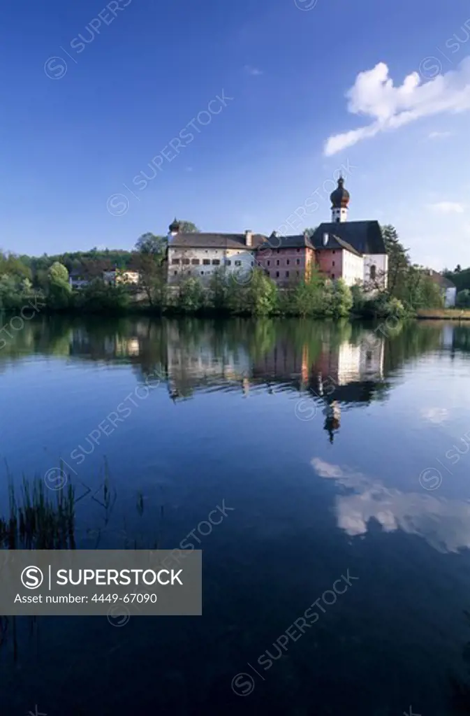 Palace of Hoeglwoerth and reflections in pond, Chiemgau, Upper Bavaria, Bavaria, Germany