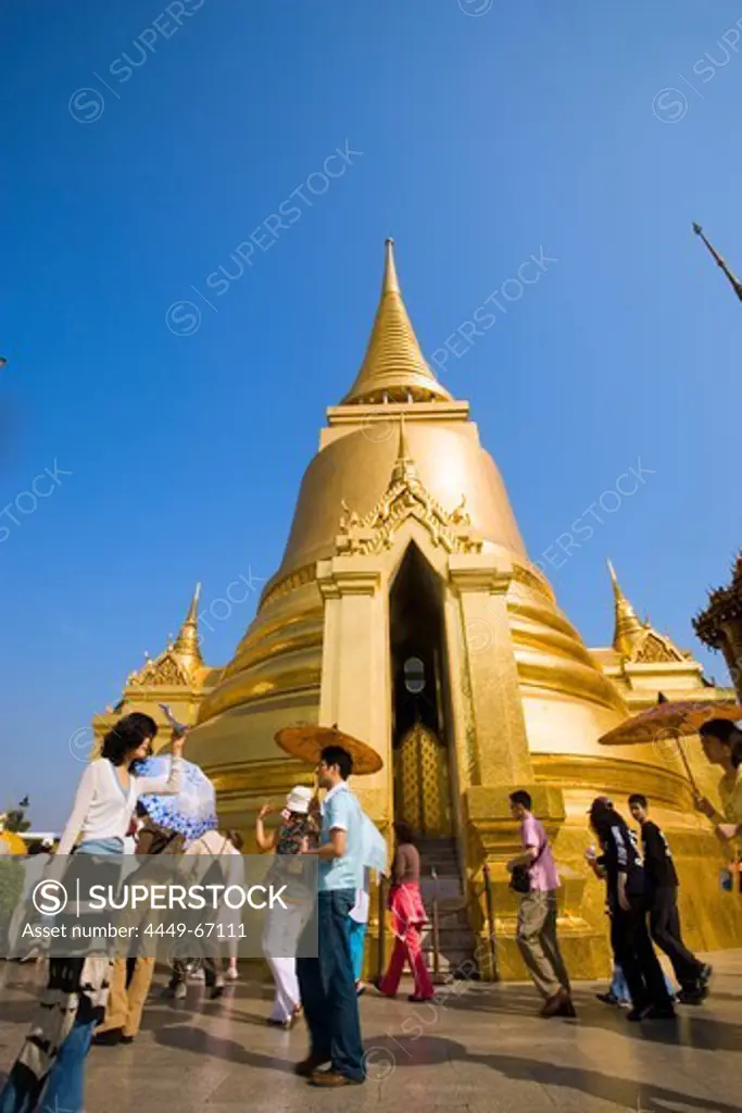 Tourists visiting Phra Sri Rattana Chedi, Wat Phra Kaew, the most important Buddhist temple of Thailand, Ko Ratanakosin, Bangkok, Thailand
