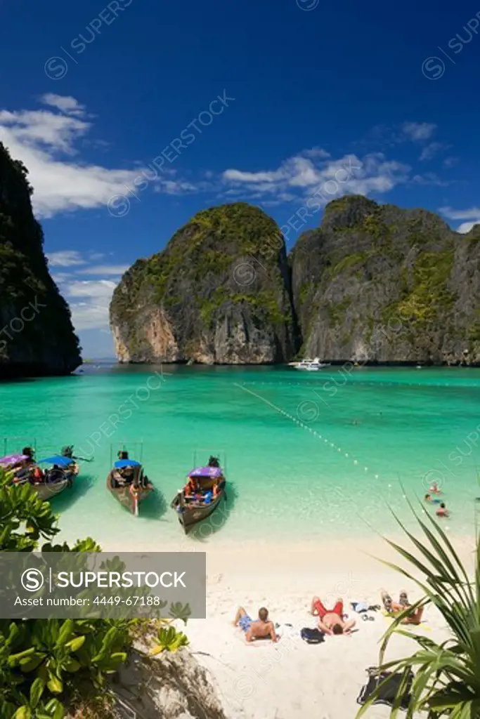 View over Maya Bay, a beautiful scenic lagoon, famous for the Hollywood film ""The Beach"" with sunbathing tourists and anchored boats, Ko Phi-Phi Leh, Ko Phi-Phi Islands, Krabi, Thailand, after the tsunami