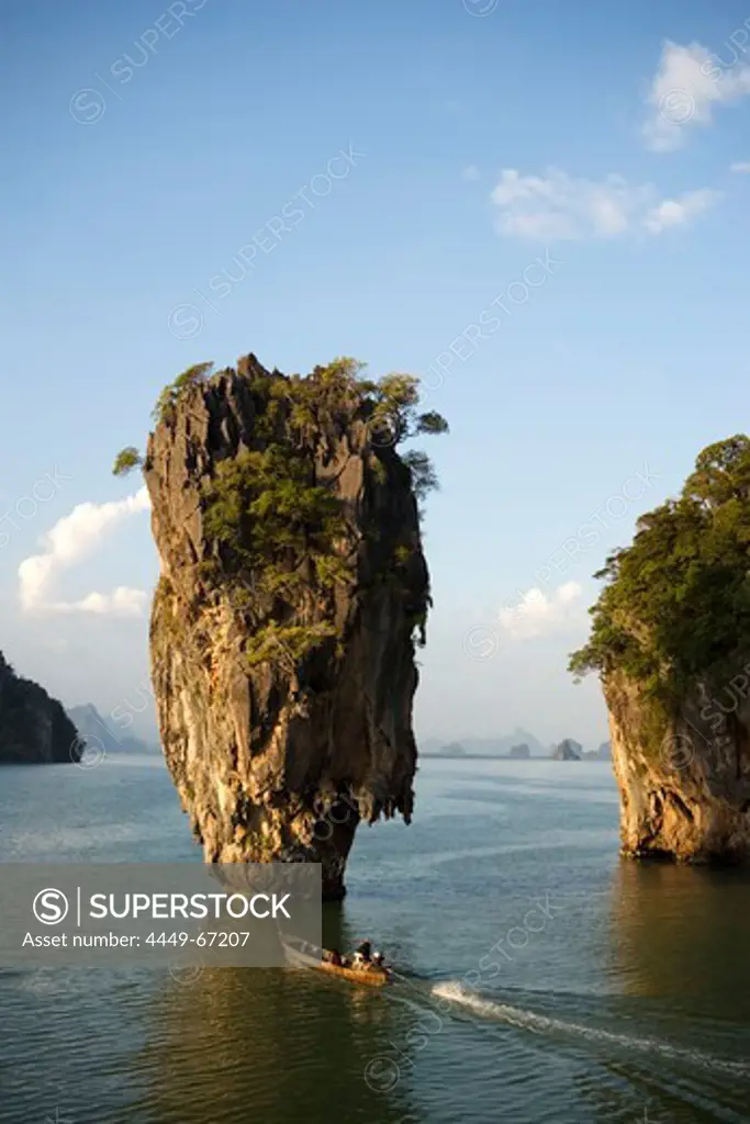 View to Koh Tapu, so-called James Bond Island, The Man with the Golden Gun, people in a longtail boat in foreground, Ko Khao Phing Kan, Phang-Nga Bay, Ao Phang Nga Nation Park, Phang Nga, Thailand