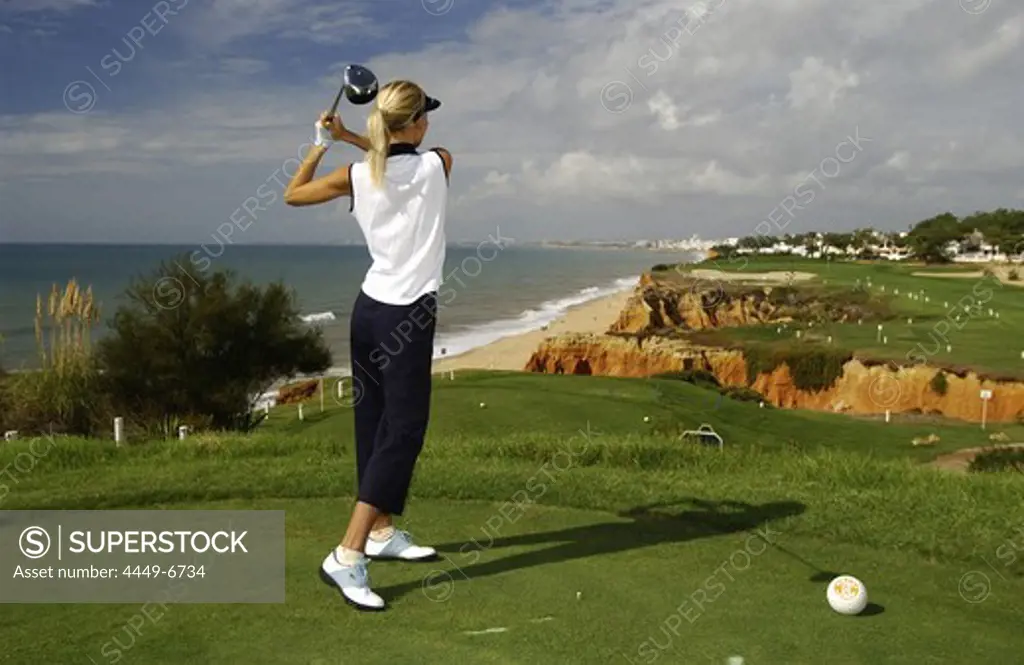Woman playing golf at Vale do Lobo, Portugal