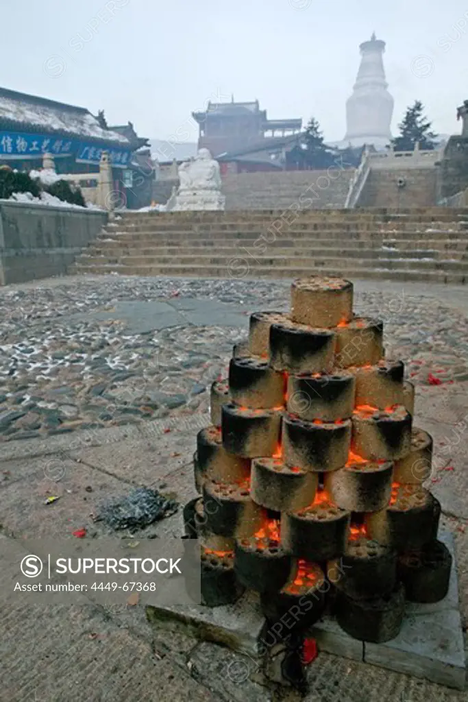 Fire with coal for the Chinese New Year festival, Great White Pagoda, village of Taihuai, Mount Wutai, Wutai Shan, Five Terrace Mountain, Buddhist centre, town of Taihuai, Shanxi province, China