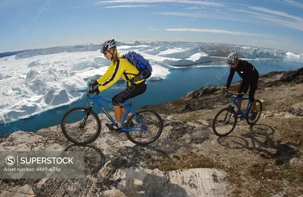 A couple on a mountainbike tour, Ilulissat, Greenland