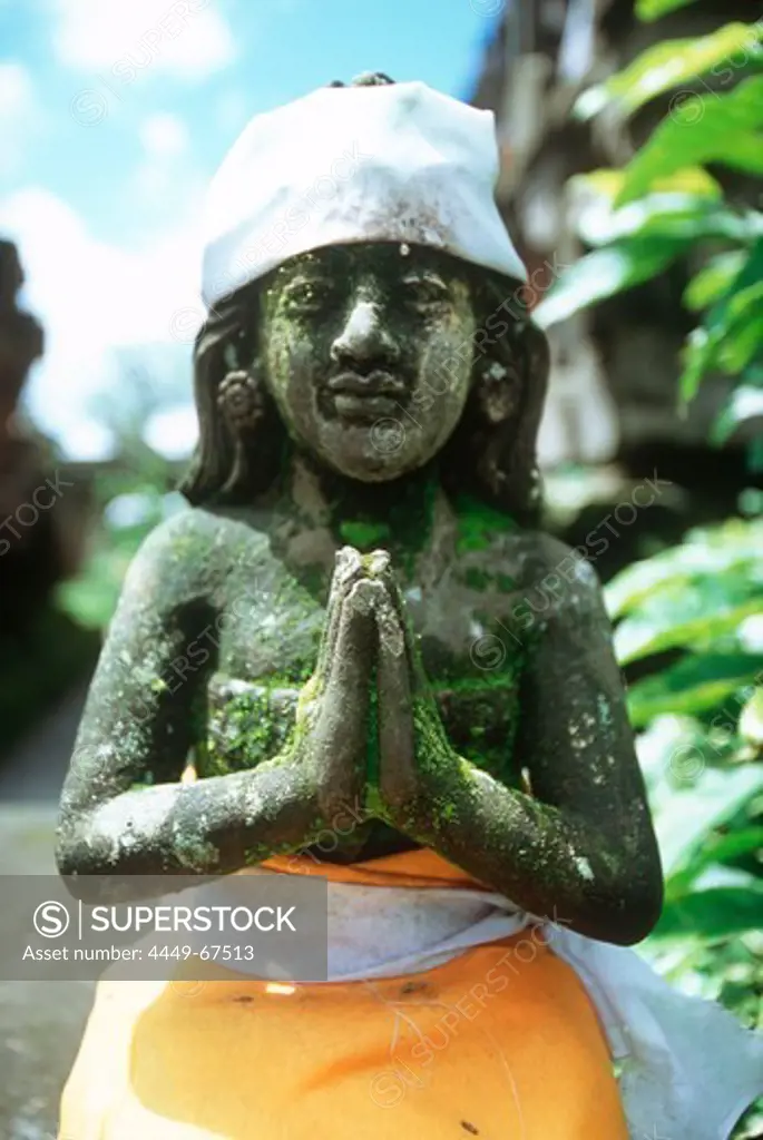 tempel statue with cloth, kitamani, bali, indonesia